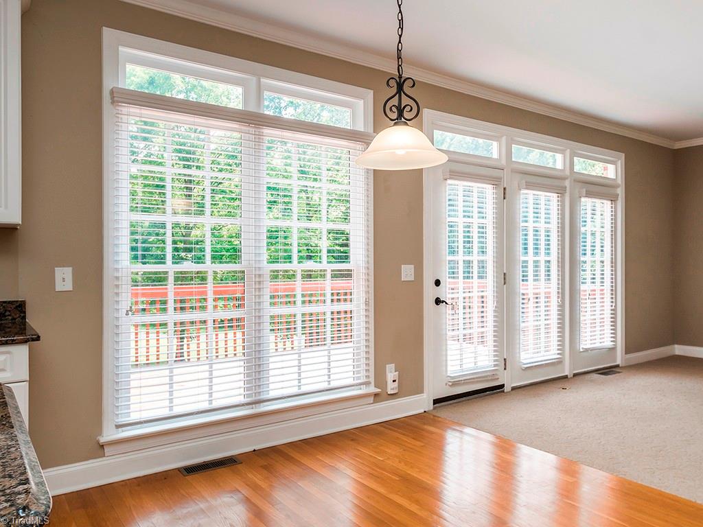 8302 Case Ridge Drive Oak Ridge, NC 27310 - Photo 14 of 29 Breakfast area is flooded with light.