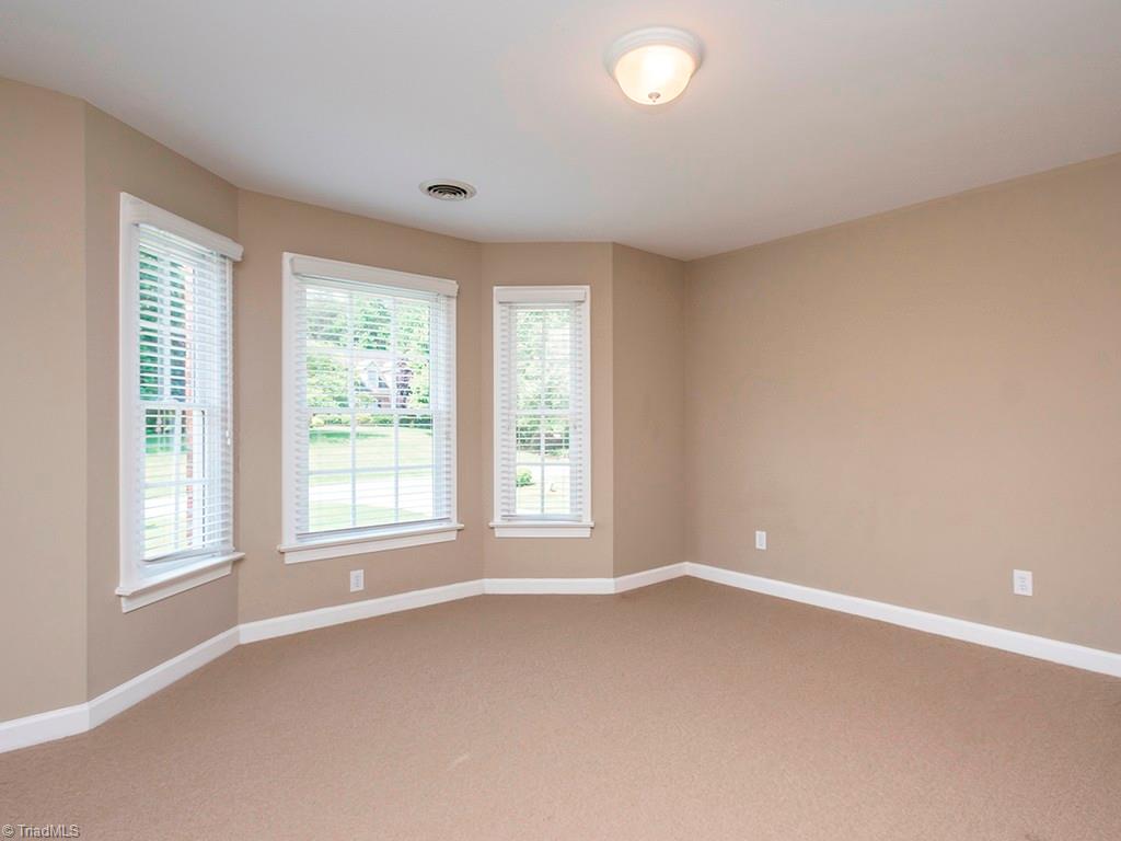8302 Case Ridge Drive Oak Ridge, NC 27310 - Photo 22 of 29 3rd bedroom with bay window, also attached to hall bath.