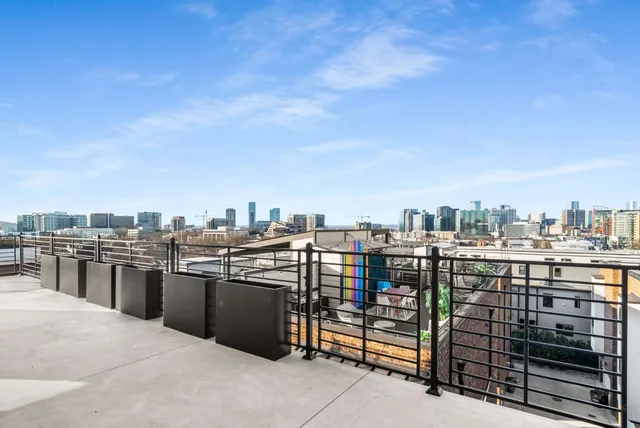 a large bathroom with a granite countertop double vanity