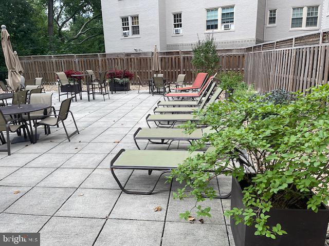 2737 Devonshire Place Northwest, Unit 327 Washington, DC 20008 - Photo 12 of 16 a view of a chairs and tables in the back yard of the house