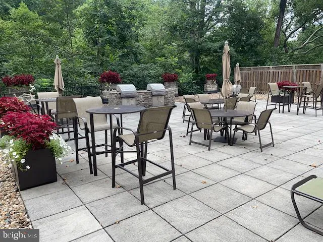 a view of a dinning table and chairs in the patio