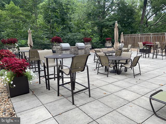 2737 Devonshire Place Northwest, Unit 327 Washington, DC 20008 - Photo 13 of 16 a view of a dinning table and chairs in the patio
