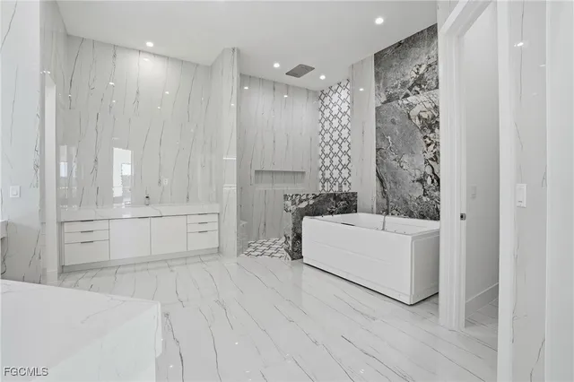 a bathroom with a bathtub and a shower