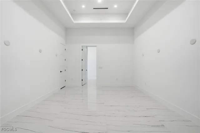 a kitchen with a refrigerator and window