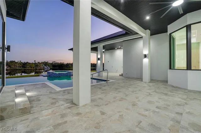 wooden floor with two chairs and a table