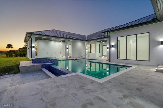 a front view of a house with a garden and porch