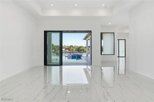 en empty room with window and outdoor view