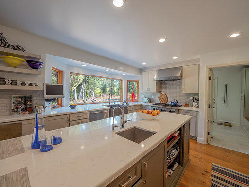 37600 Vedder Road Burney, CA 96013 - Photo 16 of 69 a kitchen with stainless steel appliances a sink a stove and a refrigerator