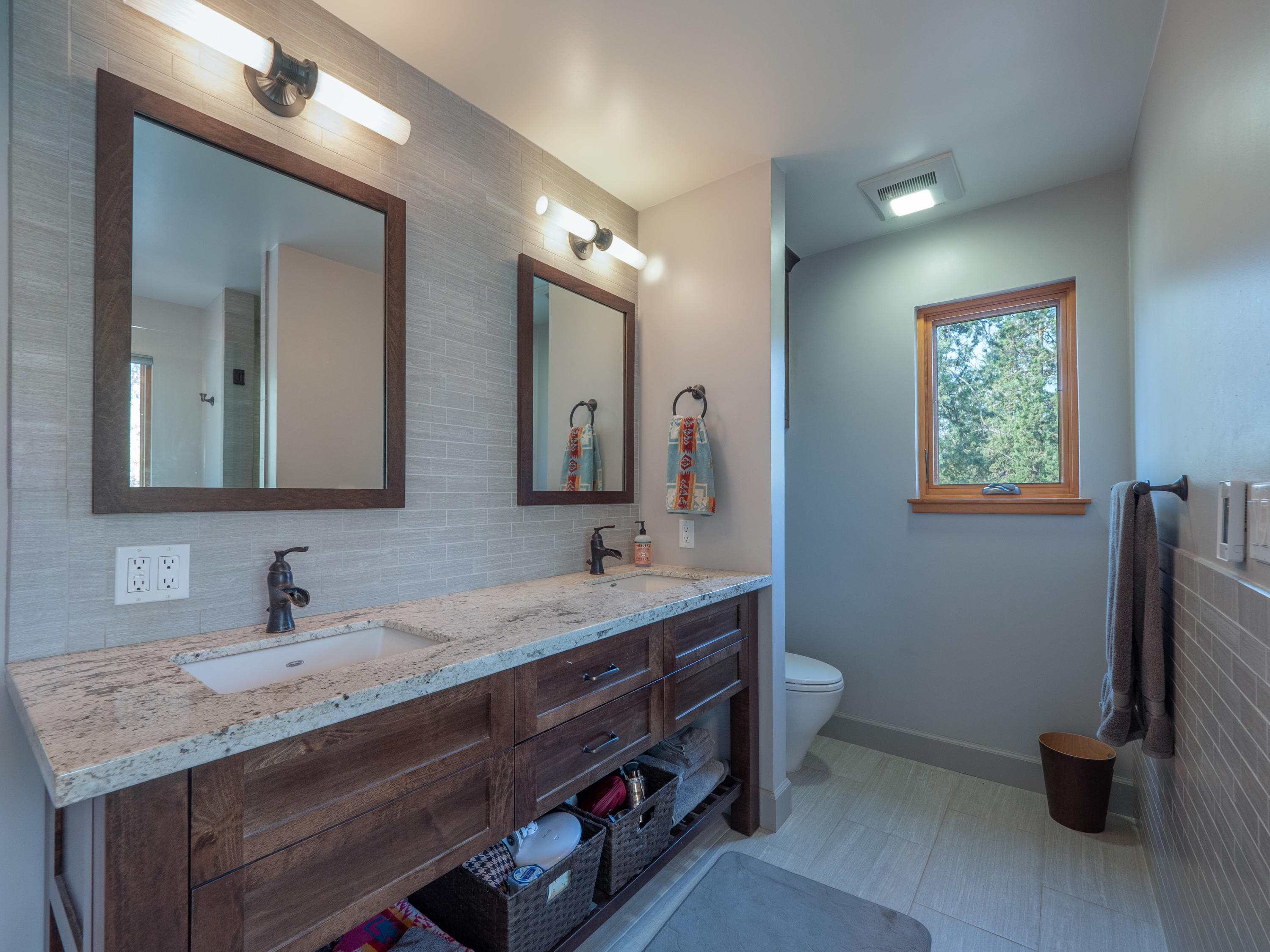 37600 Vedder Road Burney, CA 96013 - Photo 23 of 69 a bathroom with a double vanity sink and a mirror