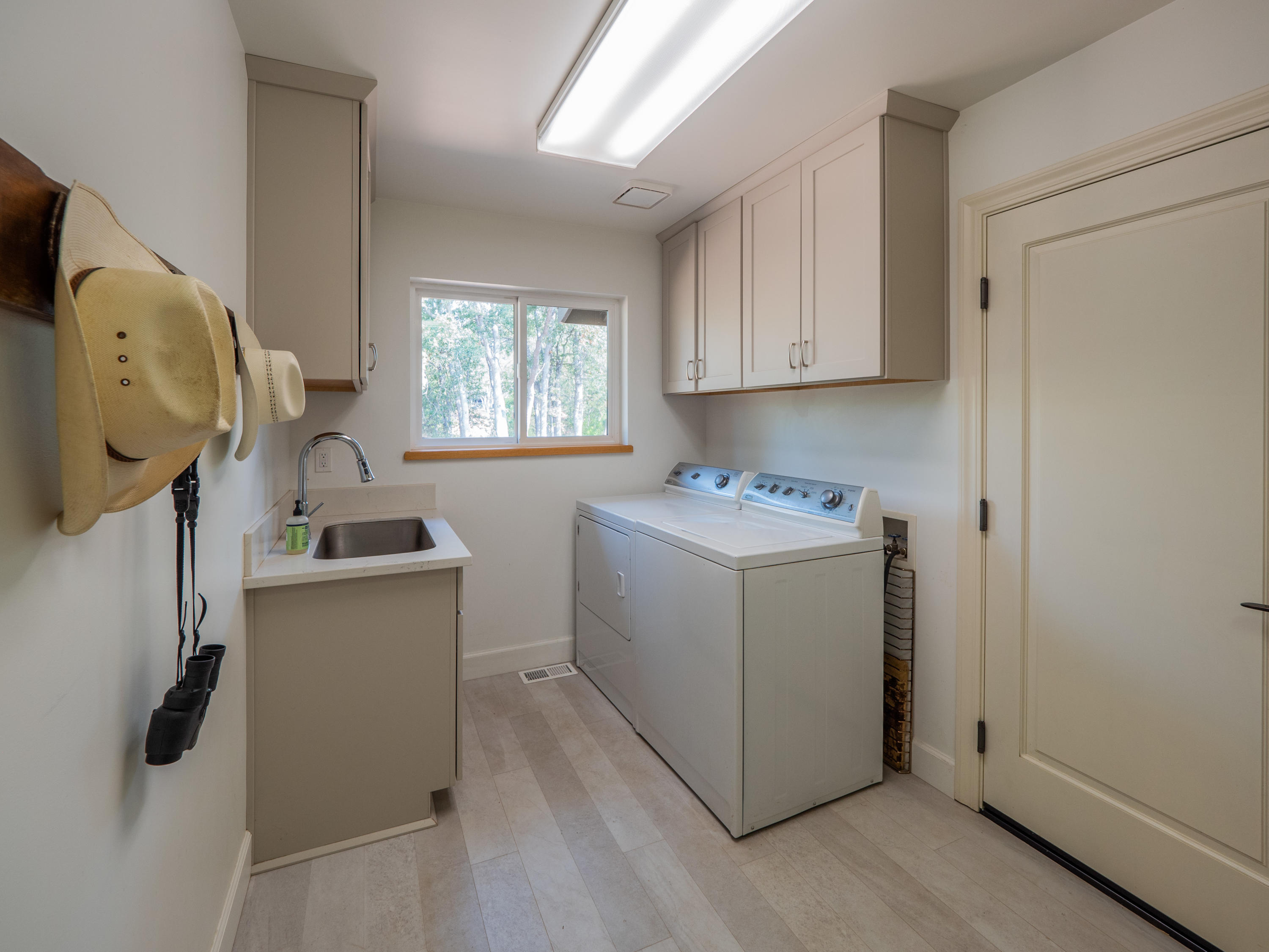 37600 Vedder Road Burney, CA 96013 - Photo 31 of 69 a utility room with cabinets washer and dryer