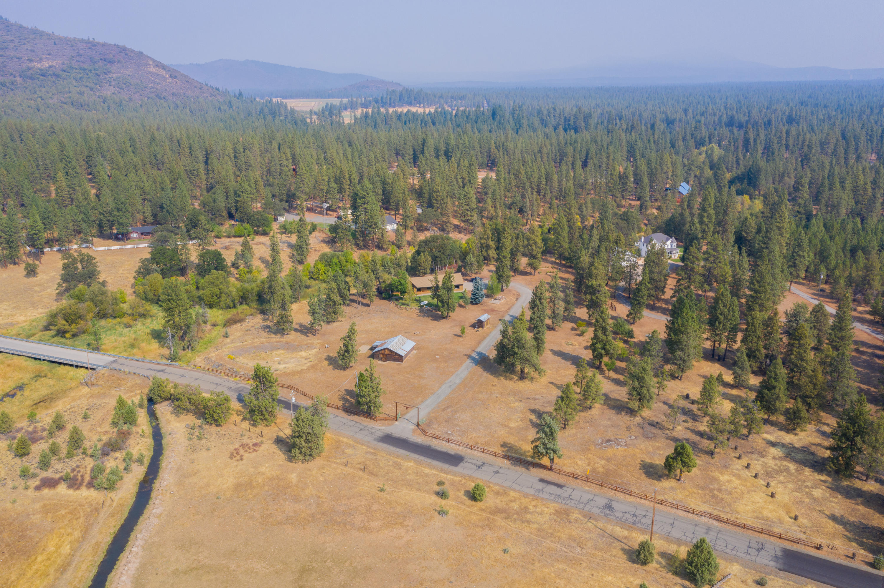 37600 Vedder Road Burney, CA 96013 - Photo 39 of 69 a view of a town with mountains in the background