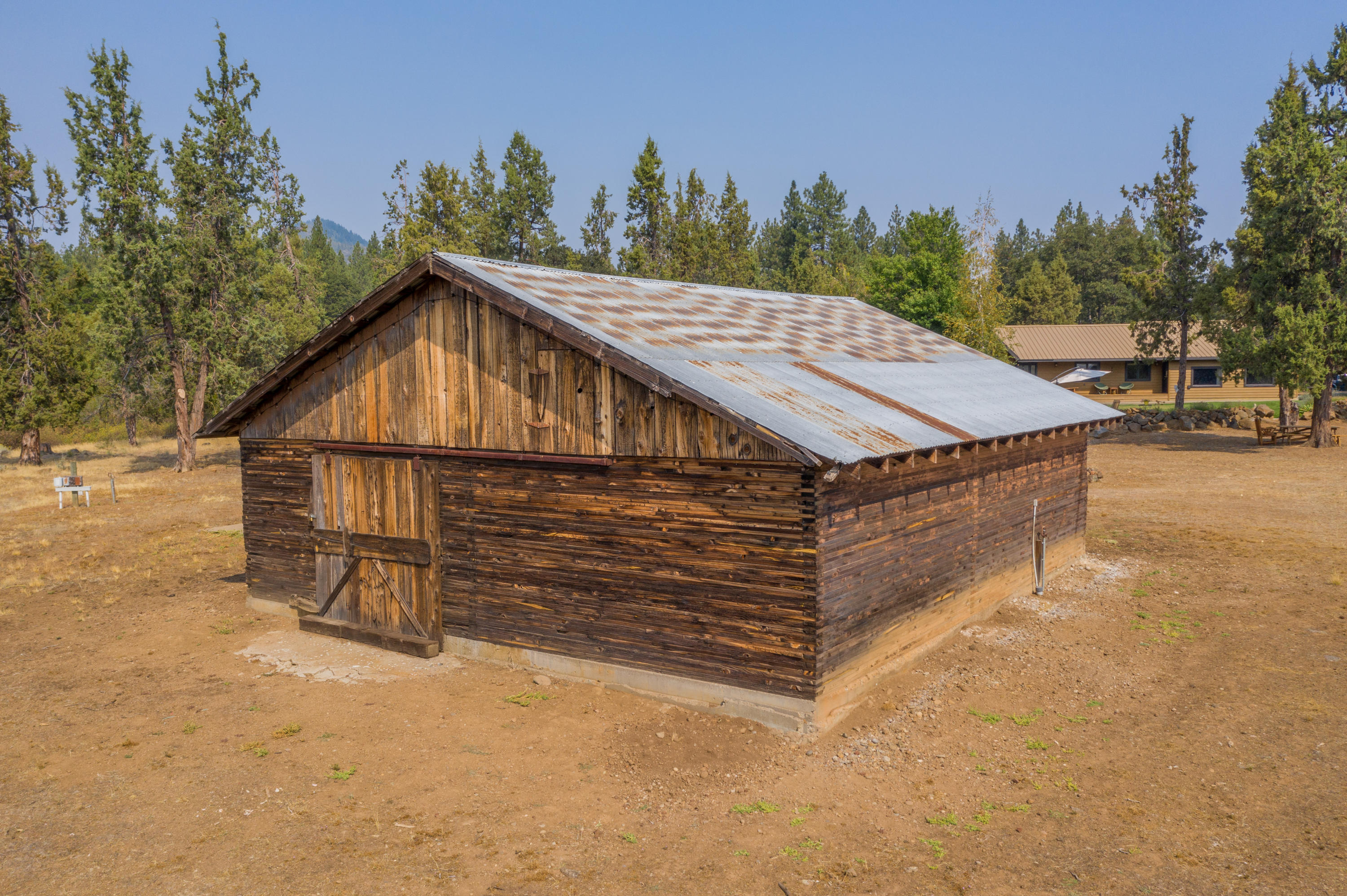 37600 Vedder Road Burney, CA 96013 - Photo 48 of 69 a view of a wooden house with a yard