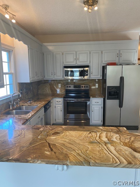 18630 Templeton Road Disputanta, VA 23842 - Photo 11 of 41 a kitchen with stainless steel appliances granite countertop a sink stove and refrigerator