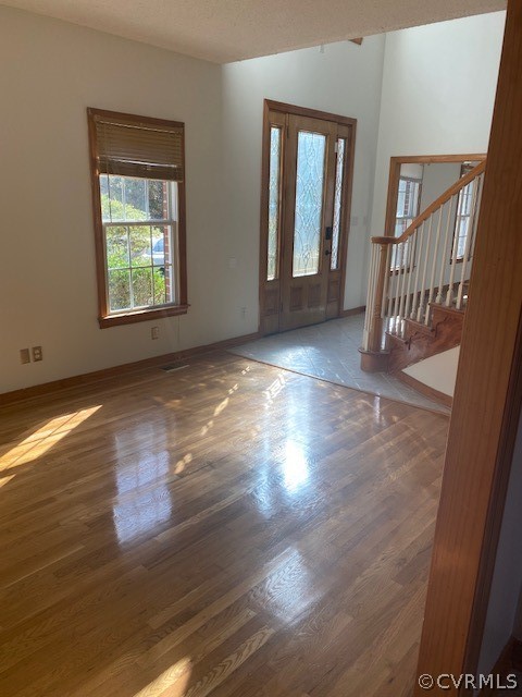 18630 Templeton Road Disputanta, VA 23842 - Photo 2 of 41 an empty room with wooden floor and windows
