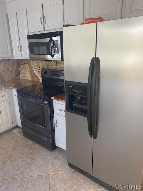 18630 Templeton Road Disputanta, VA 23842 - Photo 9 of 41 a kitchen with stainless steel appliances granite countertop a refrigerator and microwave