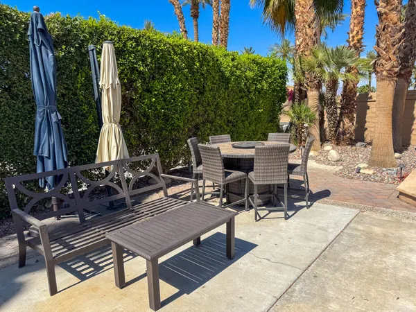 a view of a chairs and tables in the patio