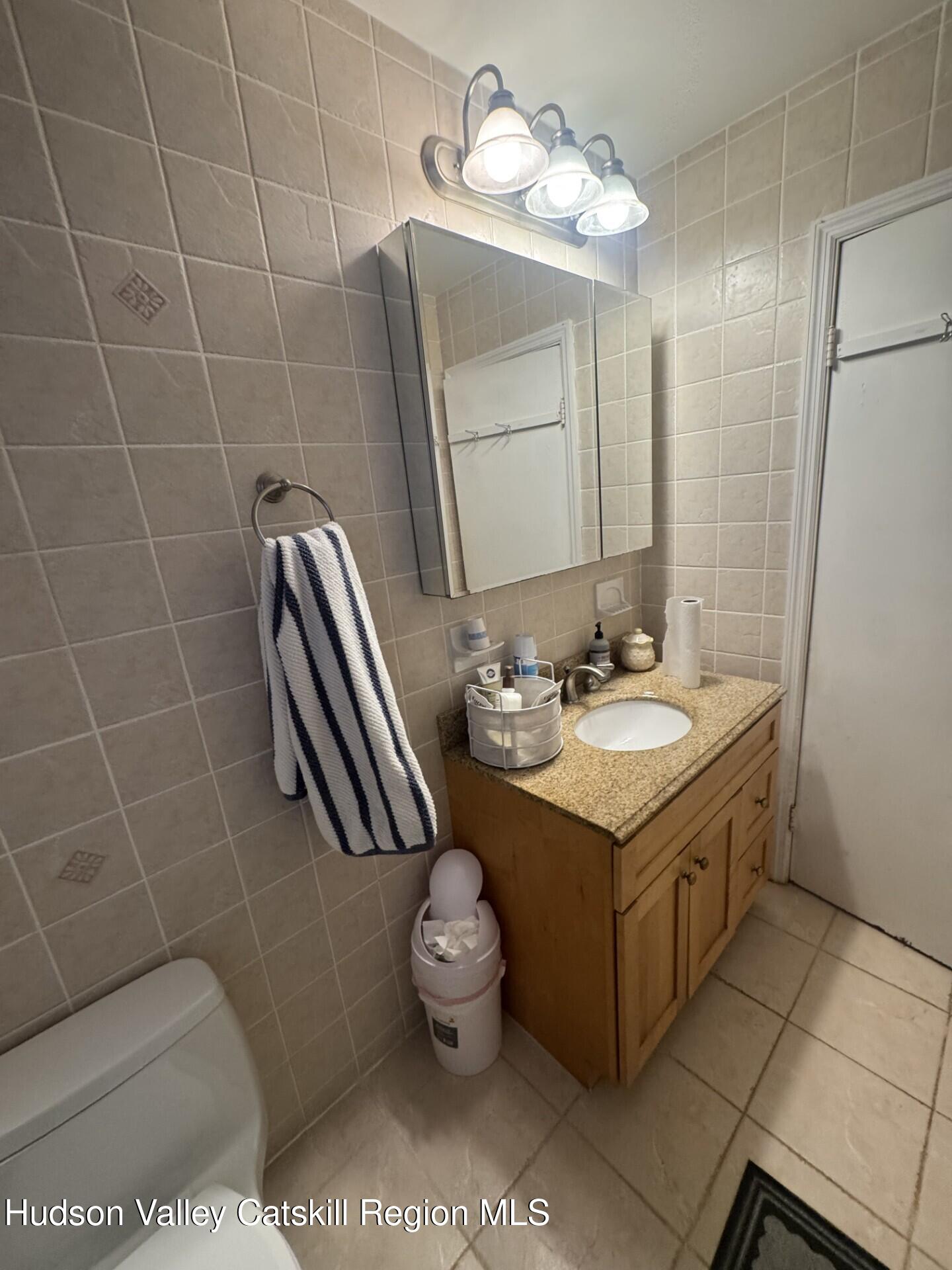 107 Route 40 Road Hensonville, NY 12439 - Photo 17 of 22 a bathroom with a sink a toilet and mirror
