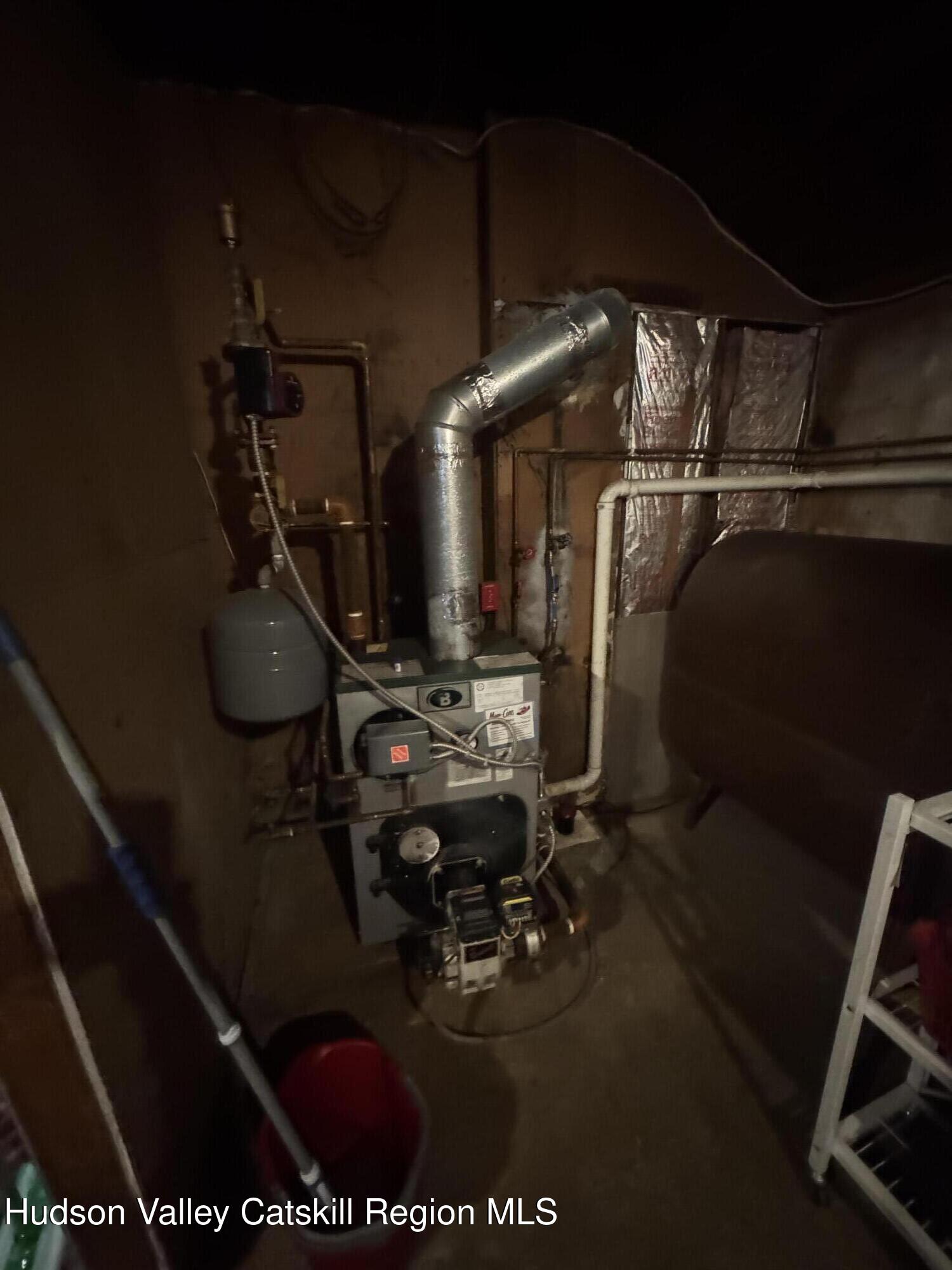 107 Route 40 Road Hensonville, NY 12439 - Photo 18 of 22 a room with water heater and wooden racks