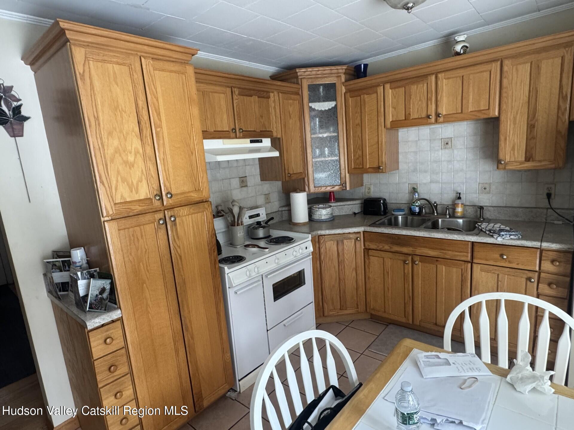 107 Route 40 Road Hensonville, NY 12439 - Photo 7 of 22 a kitchen with sink a refrigerator and cabinets
