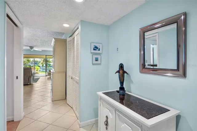 a living room with furniture a rug and a lamp