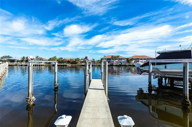 a wooden pier with boats