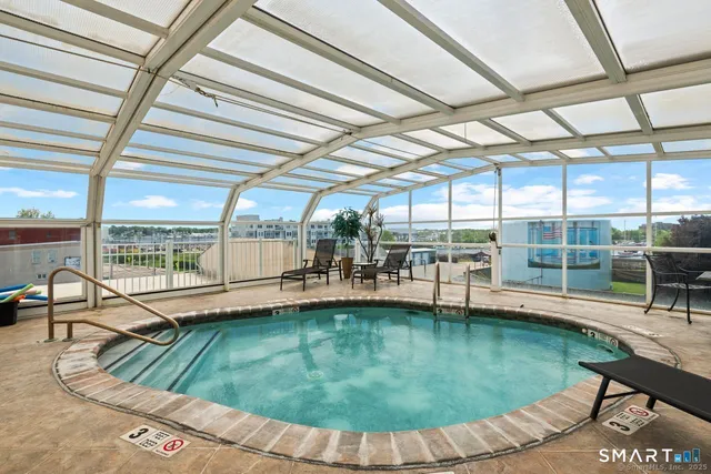 a view of a swimming pool with a patio