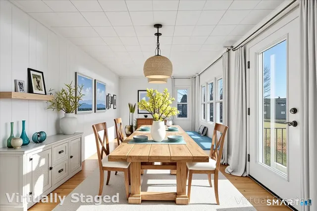 a view of a dining room with furniture window and wooden floor