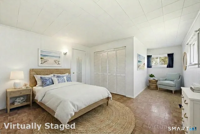 a bathroom with a toilet a sink a tub and mirror