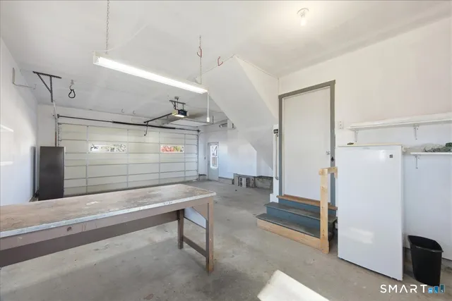 a view of empty room with wooden ceiling