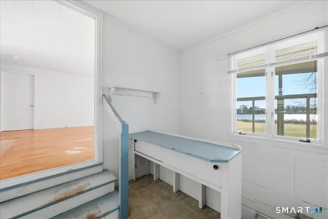 a bathroom with a mirror a sink and a shower