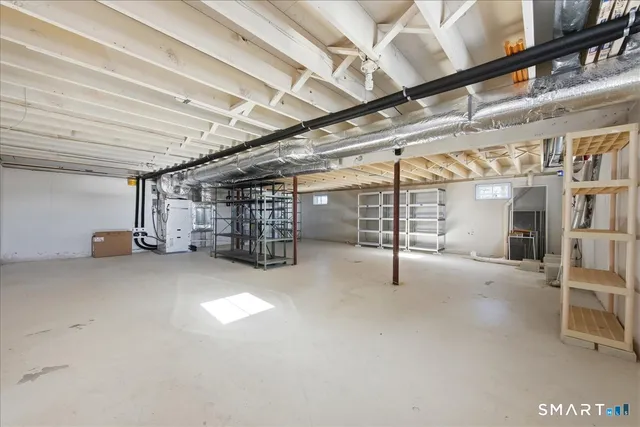 an aerial view of a house with a swimming pool and outdoor seating