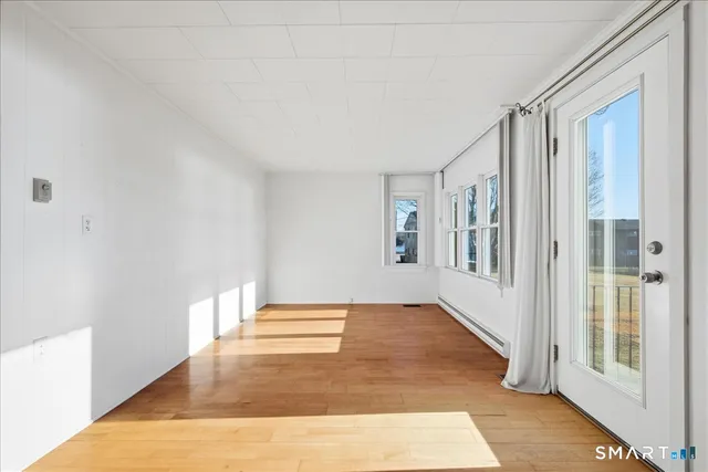 a view of an empty room with glass door