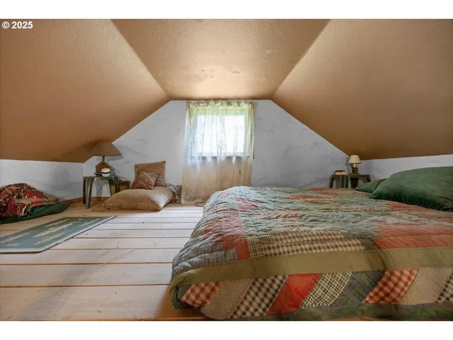 a picture of a bench in front of a wall