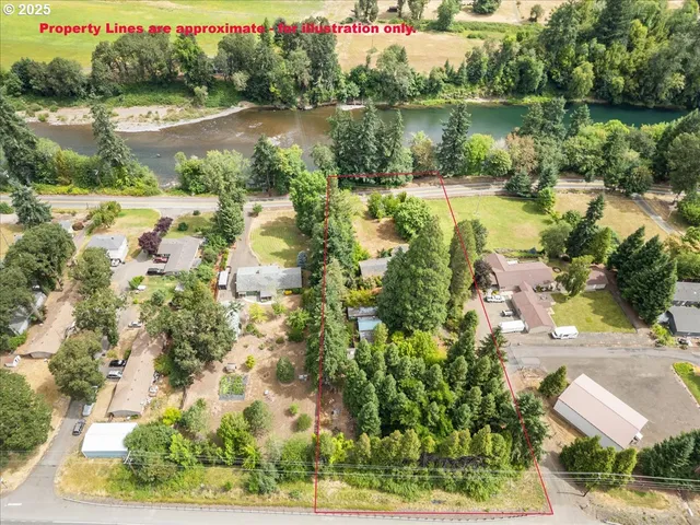 an aerial view of lake residential house with outdoor space and trees around