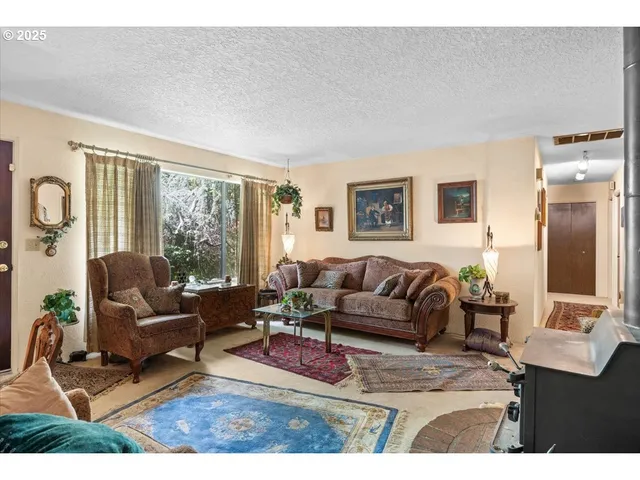 a living room with furniture and large windows