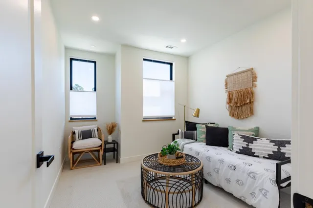 a view of a chairs and table in patio