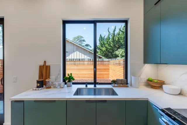 a kitchen with a sink and a window
