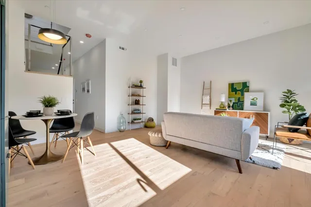 a living room with furniture and a table