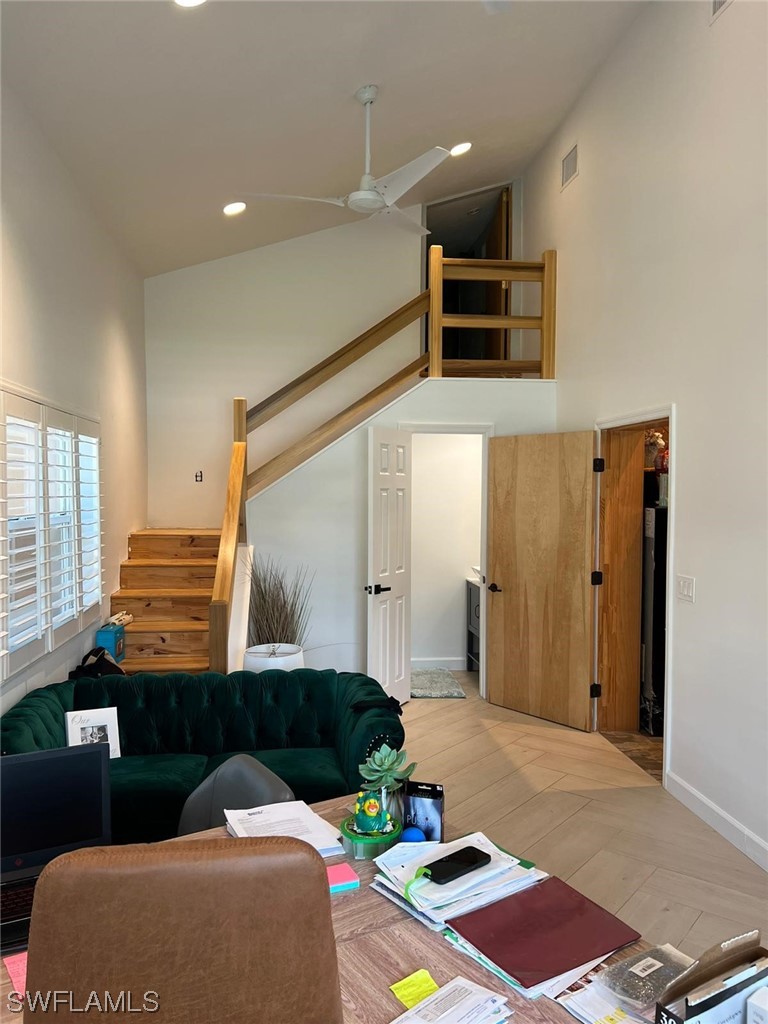 1337 Bradford Road Fort Myers, FL 33901 - Photo 14 of 46 a living room with a couch and a table with wooden floor