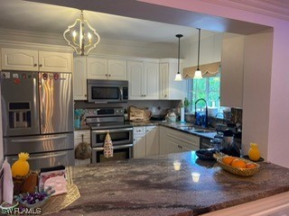 1337 Bradford Road Fort Myers, FL 33901 - Photo 15 of 46 a kitchen with sink refrigerator and microwave