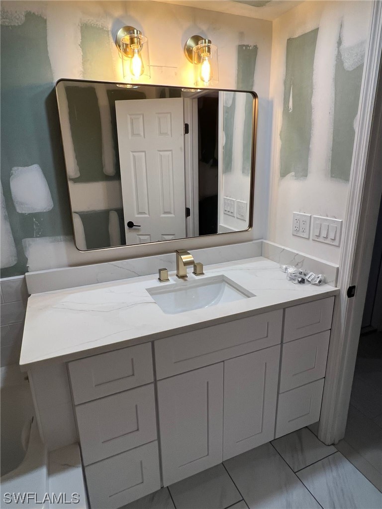 1337 Bradford Road Fort Myers, FL 33901 - Photo 27 of 46 a bathroom with a sink and a mirror