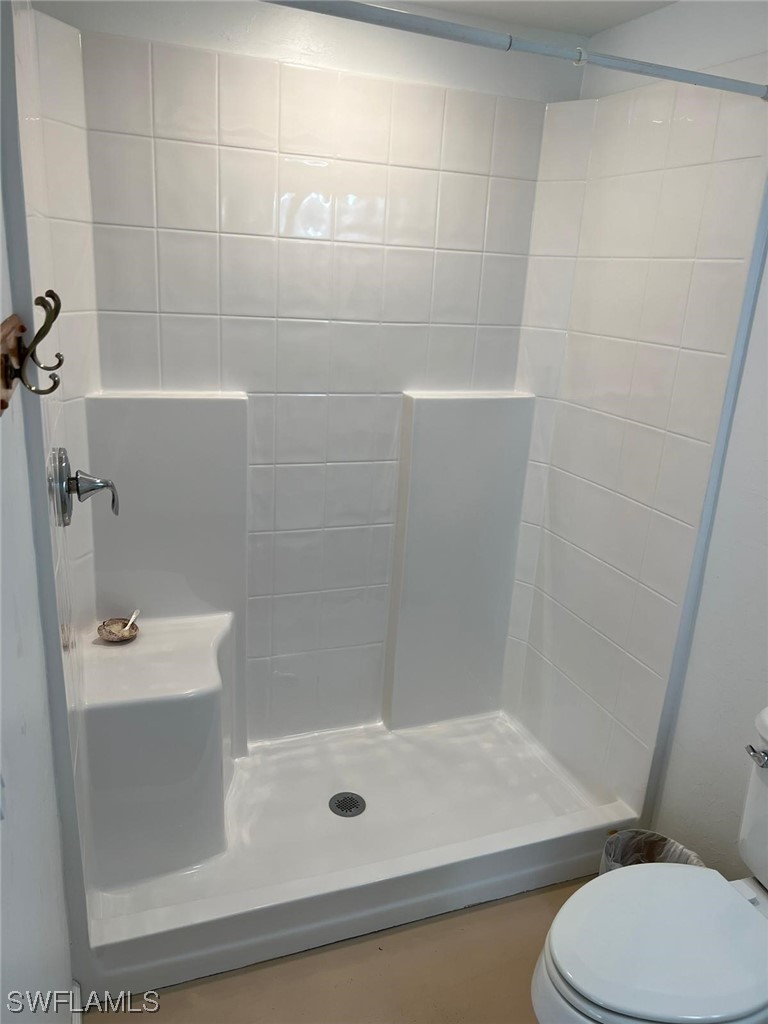 1337 Bradford Road Fort Myers, FL 33901 - Photo 38 of 46 a bathroom with a shower and toilet
