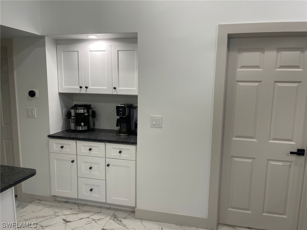 1337 Bradford Road Fort Myers, FL 33901 - Photo 41 of 46 a room with white cabinets and a sink