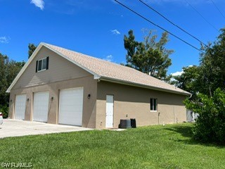 1337 Bradford Road Fort Myers, FL 33901 - Photo 5 of 46 a front view of a house with a yard