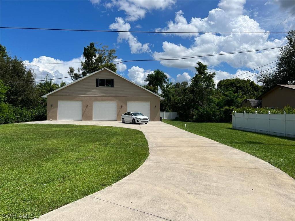 1337 Bradford Road Fort Myers, FL 33901 - Photo 7 of 46 a front view of a house with a yard