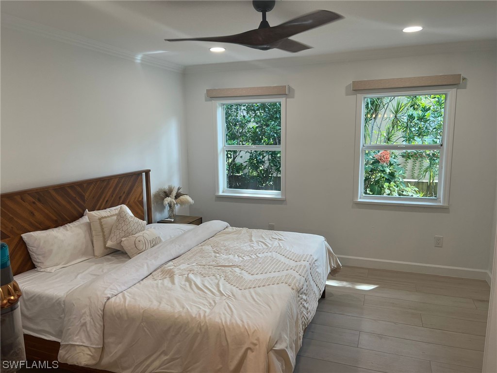 1337 Bradford Road Fort Myers, FL 33901 - Photo 9 of 46 a bedroom with a bed and a window