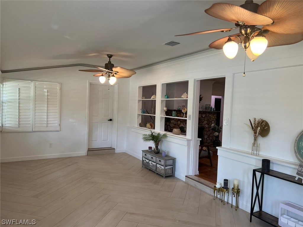 1337 Bradford Road Fort Myers, FL 33901 - Photo 10 of 46 a view of a livingroom with furniture and chandelier