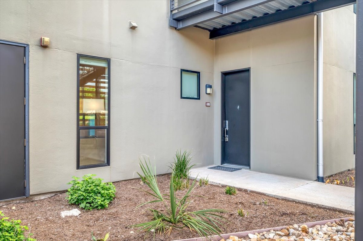 1101 Ivean Pearson Road, Unit A102 Lago Vista, TX 78645 - Photo 17 of 31 Property entrance with stucco siding