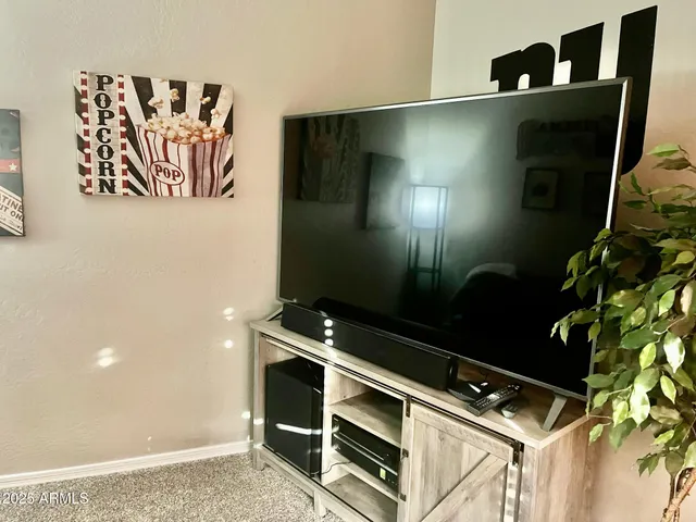 a bedroom with a bed and a desk