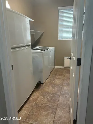 a view of a porch with yard and floor to ceiling window